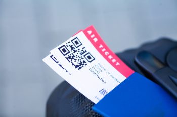 Close up two air ticket in abroad passport near airport Close up two air ticket in abroad passport near airport